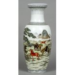A Chinese porcelain vase Decorated with wild horses in a landscape opposing calligraphic script,