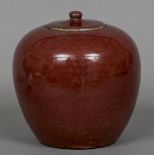 A 19th century Chinese sang de boeuf ginger jar Of typical lidded ovoid form. 20 cm high.