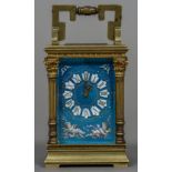 A miniature enamel decorated brass cased carriage clock The blue guilloche enamel ground decorated