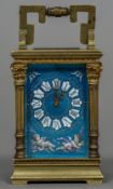 A miniature enamel decorated brass cased carriage clock The blue guilloche enamel ground decorated