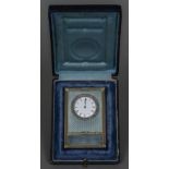 A small rose diamond set silver gilt mounted blue guilloche enamel desk clock The white enamelled