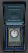 A small rose diamond set silver gilt mounted blue guilloche enamel desk clock The white enamelled