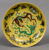 A Chinese porcelain charger Decorated with two five clawed dragons chasing a flaming pearl