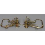 A pair of Victorian brass gas light wall sconces The hinged arm with foliate scroll work.