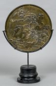 A large Chinese polished bronze mirror Decorated to one side with cranes amongst foliage and