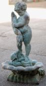 A patinated bronze garden fountain Formed as a putto holding a fish, a turtle at this feet,