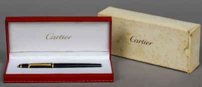 A boxed Cartier ballpoint pen The pen 14 cm long.