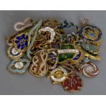 A quantity of vintage enamelled racing badges,