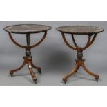 A pair of early 19th century mahogany globe stands Each of typical form,