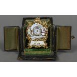 A miniature Swiss desk clock Decorated with enamelled figural vignettes,