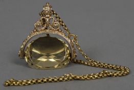 A large 9 ct gold mounted citrine fob With ornate scrolling frame, mounted on a 9 ct gold chain. 4.