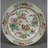 An 18th/19th century Chinese porcelain plate Decorated with ducks on a pond amongst floral sprays.