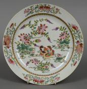 An 18th/19th century Chinese porcelain plate Decorated with ducks on a pond amongst floral sprays.