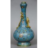 A Chinese cloisonne vase The slender neck and baluster body decorated with lotus strapwork with