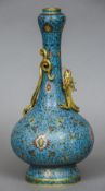 A Chinese cloisonne vase The slender neck and baluster body decorated with lotus strapwork with