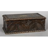 A 19th century carved oak offertory box The hinged rectangular top with coin aperture,