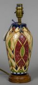 A modern Moorcroft pottery table lamp With stylised Arts & Crafts decoration. 31 cm high.