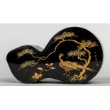 A late 19th/early 20th century Japanese lacquered box The shaped removable lid decorated with an