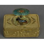 A 19th century Continental ormolu cased musical bird box The hinged cover set with a pastoral scene