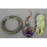 A Chinese jade pendant Formed as a mythical beast; together with a pierced jade bangle;