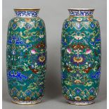 A pair of Chinese porcelain vases Each extensively decorated with lotus strapwork on a green ground,