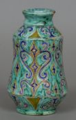 A faience vase Of waisted cylindrical form, decorated with blue scrollwork on a turquoise ground,