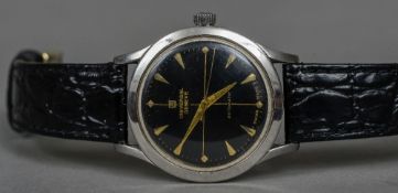 A Universal Stainless steel cased automatic gentleman's wristwatch The black signed dial with baton