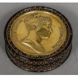 A 19th century Continental gilt decorated tortoiseshell snuff box Of circular section,