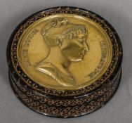 A 19th century Continental gilt decorated tortoiseshell snuff box Of circular section,