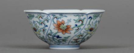 A Chinese porcelain wine cup With shaped rim and decorated with lotus strapwork,