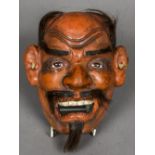 A late 19th century Japanese mask of Noh Of typical form, with open mouth. 18 cm high.