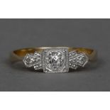 A 9 ct gold and platinum Art Deco three stone diamond ring CONDITION REPORTS: