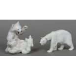 A Royal Copenhagen porcelain animalier group formed as two polar bears Together with another