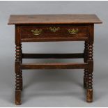 A 18th century oak side table The rectangular top above the single frieze drawer,