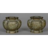 A pair of Chinese brass censors Each of lobed form, engraved with mythical beasts,
