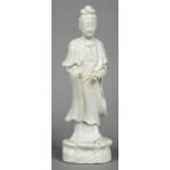 A Chinese blanc de chine porcelain figure of Guanyin Typically modelled. 38 cm high.