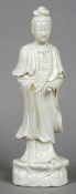 A Chinese blanc de chine porcelain figure of Guanyin Typically modelled. 38 cm high.