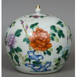 A Chinese porcelain ginger jar and cover Decorated overall with floral sprays. 23 cm high overall.