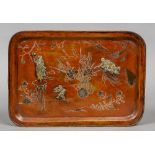 A late 19th/early 20th century Japanese tray Incised decoration with applied figures. 37 cm wide.
