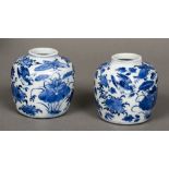 A pair of Chinese blue and white porcelain ginger jars Each decorated with birds and insects