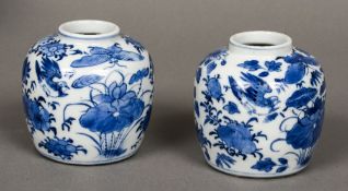 A pair of Chinese blue and white porcelain ginger jars Each decorated with birds and insects