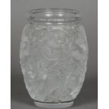 A Lalique vase Decorated in the round with nesting birds, the underside inscribed Lalique France.