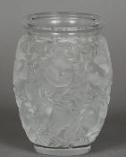 A Lalique vase Decorated in the round with nesting birds, the underside inscribed Lalique France.