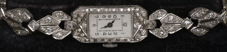 An Art Deco diamond set platinum ladies cocktail watch The white dial with Arabic numerals. 1.