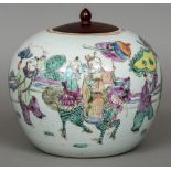 A Chinese porcelain ginger jar and wooden cover The body decorated with figures in a continuous