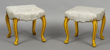 A pair of 19th century upholstered painted stools Each overstuffed seat standing on scroll carved