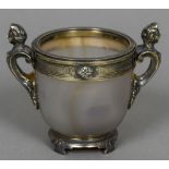 A silver gilt mounted agate cup Set with two scrolling caryatid form handles,