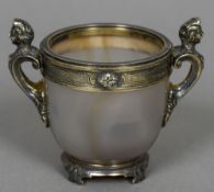 A silver gilt mounted agate cup Set with two scrolling caryatid form handles,