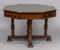 A Victorian walnut octagonal centre table The gilt tooled leather inset top above a deep frieze