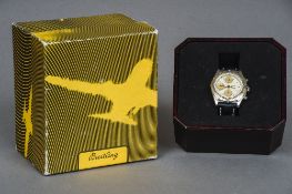 A Breitling stainless steel gentleman's chronograph wristwatch With 18 ct gold bezel and original